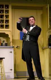 Pedrillo (Tim Oliver, tenor) pours a sleep serum as part of the escape plan, The Abduction from the Seraglio, 2008