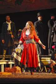 Carmen (mezzo-soprano Dana Beth Miller) warns men to watch out if she falls in love with them, Carmen, Boston Lyric Opera, 2009