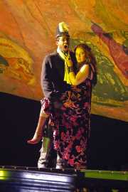 Zuniga (bass-baritone Darren Stokes*), Commanding Officer of the Spanish soldiers, threatens Carmen (mezzo-soprano Dana Beth Miller) who is distracting his officer Don José., Carmen, Boston Lyric Opera, 2009