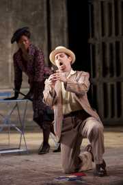 Don Giovanni’s servant, Leporello (bass-baritone Matthew Burns) catalogues the Don’s 2,065 conquests as jilted lover Donna Elvira (soprano Kimwana Doner) listens in disbelief, Don Giovanni, Boston Lyric Opera, 2009