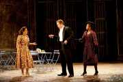 Zerlina (soprano Heather Johnson) listens to Don Giovanni (baritone Christopher Schaldenbrand) as he tries to discredit the claims of his former lover, Donna Elvira (soprano Kimwana Doner), Don Giovanni, Boston Lyric Opera, 2009