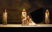 Ariadne (soprano Marjorie Owens) laments being stranded on the island of Naxos by her groom Theseus as her Nymphs (soprano Joanna Mongiardo, mezzo-soprano Andrea Coleman, soprano Mara Bonde) look on with pity., Ariadne auf Naxos, Boston Lyric Opera, 2010