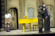 Count Almaviva (tenor Charles Blandy), disguised as a soldier, tries to distract Doctor Bartolo (bass-baritone T. Steven Smith, in plaid) and Don Basilio (bass-baritone Frank Ward, Jr., in trench coat) so that he can give Rosina (mezzo-soprano Nicole Rodin) a love letter. Doctor Bartolo’s barber, Figaro (baritone Gregory Gerbrandt), assists with the ruse., The Barber of SevilleRosina (mezzo-soprano Nicole Rodin) does not yet recognize her love, Count Almaviva (tenor Charles Blandy), who is disguised as a soldier trying to befriend her guardian, Doctor Bartolo (bass-baritone T. Steven Smith)., Boston Lyric Opera, 2010