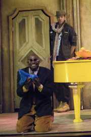 Don Basilio (bass-baritone Frank Ward, Jr.) gleefully plots a way to slander Count Almaviva’s name, as Figaro (baritone Gregory Gerbrandt) listens in alarm., The Barber of Seville, Boston Lyric Opera, 2010