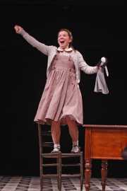 Flora (soprano Kathryn Skemp) seeks attention during a Latin lesson, The Turn of the Screw, 2010