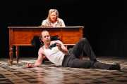 Quint (tenor Vale Rideout) and Miss Jessel (soprano Rebecca Nash) discuss their influence over the innocent children Flora and Miles, The Turn of the Screw, 2010