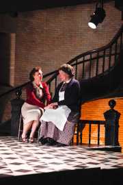 The Governess (soprano Emily Pulley) and Mrs. Gross (mezzo-soprano Joyce Castle) share a moment while Flora and Miles are preoccupied with their own interests, The Turn of the Screw, 2010