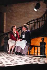 The Governess (soprano Emily Pulley) and Mrs. Gross (mezzo-soprano Joyce Castle) share a moment while Flora and Miles are preoccupied with their own interests, The Turn of the Screw, 2010