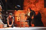 The Jailer’s Son (treble Ryan Williams) cleans the shooting area atop the Castle Sant’Angelo as the tortured Mario Cavaradossi (tenor Diego Torre) awaits his execution. Mr. Williams will also perform with the Boston Symphony Orchestra on BLO’s Opening Night and will be rushed across town to the Shubert to make his appearance!, Tosca, Boston Lyric Opera, 2010