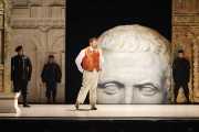 Nerone (Countertenor David Trudgen) muses about his assumed appointment as the next Emperor while sinister servants look on. Busts of Caesar appear frequently in the scenery as a representation of the Roman Empire. Photo taken at final dress rehearsal of BLO’s Agrippina by Jeffrey Dunn for Boston Lyric Opera © 2011