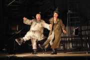 Tenor John Mac Master as Harlequin and bass Kevin Burdette as Death mock an old vaudeville performance as they yearn for yesteryear when people remembered how to laugh and live, 2011