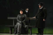 As Vanya (Omar Najmi) looks on, domineering mother Kabanicha (Elizabeth Byrne) dresses down her put-upon son Tichon Kabanov (Alan Schneider) in Boston Lyric Opera’s production of Kátya Kabanová, composed by Leoš Janáček. 2015