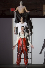 (From top): Yury Yanowsky as the Man, Neal Ferreira as The Visitor, and David McFerrin as The Officer in Boston Lyric Opera’s new “Opera Annex” production of Philip Glass’s dystopian “In the Penal Colony” based on the Franz Kafka short story, and in a limited run Nov 11-15 at the historic Cyclorama at the Boston Center for the Arts.