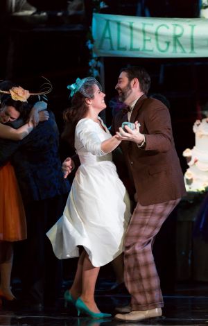 Susanna (Emily Birsan, l.) accepts a dance from her newly discovered father-in-law Basilio (Matthew DiBattista) at her wedding reception in Boston Lyric Opera’s new production of “The Marriage of Figaro” running through May 7 at John Hancock Hall