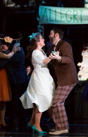 Susanna (Emily Birsan, l.) accepts a dance from her newly discovered father-in-law Basilio (Matthew DiBattista) at her wedding reception in Boston Lyric Opera’s new production of “The Marriage of Figaro” running through May 7 at John Hancock Hall