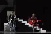 (l.r.)  Jesus Garcia as Almaviva, accompanied by Matthew Worth as Figaro, serenades outside Rosina’s perch in Boston Lyric Opera’s new production of THE BARBER OF SEVILLE, directed by Rosetta Cucchi.