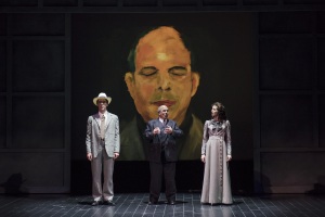Framed by a self-portrait painting, Arnold Schoenberg (Omar Ebrahim, c.) recalls a romantic moment from his past, reenacted by Jesse Darden (l.) and Sarah Womble (r.) in Boston Lyric Opera’s World Premiere SCHOENBERG IN HOLLYWOOD by composer Tod Machover and librettist Simon Robson.