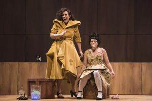 Lucy (Chelsea Basler, l.) silences Polly Peachum (Kelly Kaduce), her rival for Macheath’s affections with a piece of cake in the Boston Lyric Opera’s production of Weill and Brecht’s THE THREEPENNY OPERA, running March 16-25 at the Huntington Avenue Theatre.  BLO.org.