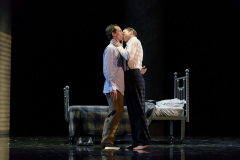 Laughlin (Jesse Darden, l) and Fuller (Jesse Blumberg, r.) spark their first night of passion with a kiss in Boston Lyric Opera’s production of “Fellow Travelers,” playing Nov. 13-17 at the Emerson Paramount Center.