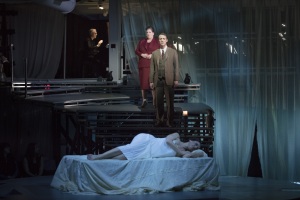 After greeting Tarquinius and granting him shelter, Lucretia (Kelley O’Connor) sleeps while the Female Chorus and Male Chorus (Antonia Tamer and Jesse Darden) foretell her fate in Boston Lyric Opera’s production of “The Rape of Lucretia” March 11-17 at Artists for Humanity EpiCenter.