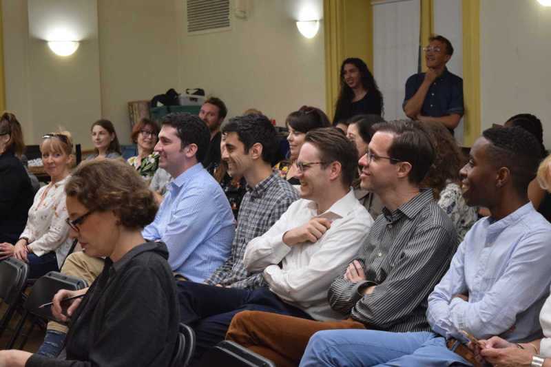 OmarNajmi and Brendon Shapiro laugh with BLO staff while preparing for Boston Lyric Opera's 2019 production of Pagliacci