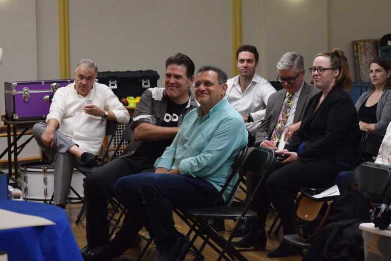 Rafael Rojas Michael Mayes and Tobias Greenhalgh laugh with BLO staff while preparing for Boston Lyric Opera's 2019 production of Pagliacci