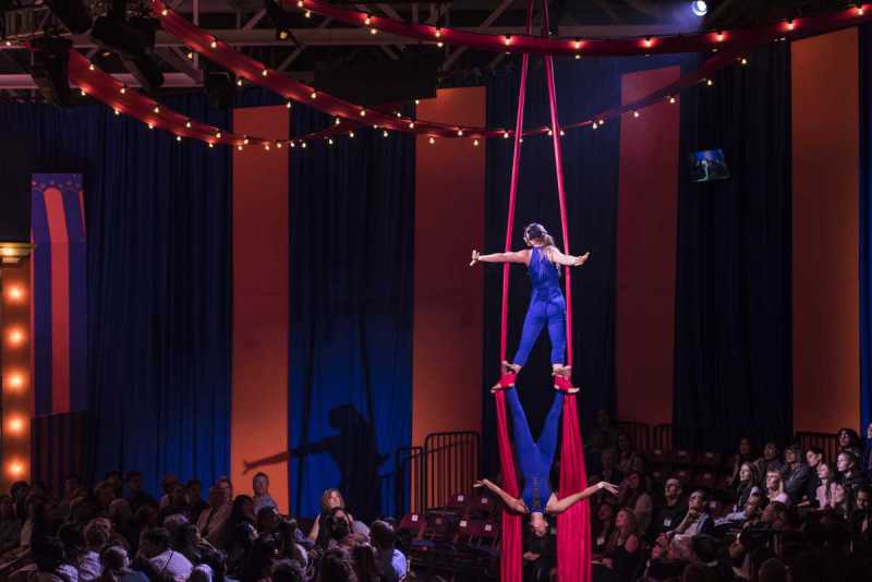 Two aerialists perform a routine on the silks during Boston Lyric Opera's 2019 production of Pagliacci