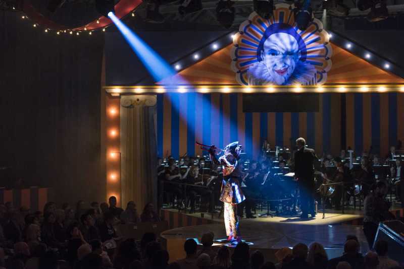 Omar Najmi as Harlequin opens the commedia dell’arte in the second act with a trumpeting announcement.