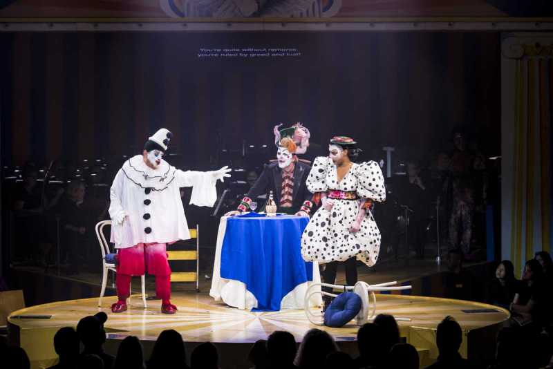Rafael Rojas’ character Canio as Pagliacci accuses Lauren Michelle’s character Nedda of having a lover while Michael Mayes’s character Canio watches on. Boston Lyric Opera's 2019 production of Pagliacci