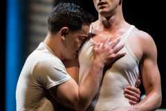 Andres Acosta as Timothy Laughlin and Hadleigh Adams as Hawkins Fuller embrace in Minnesota Operas 2018 Production of Fellow Travelers