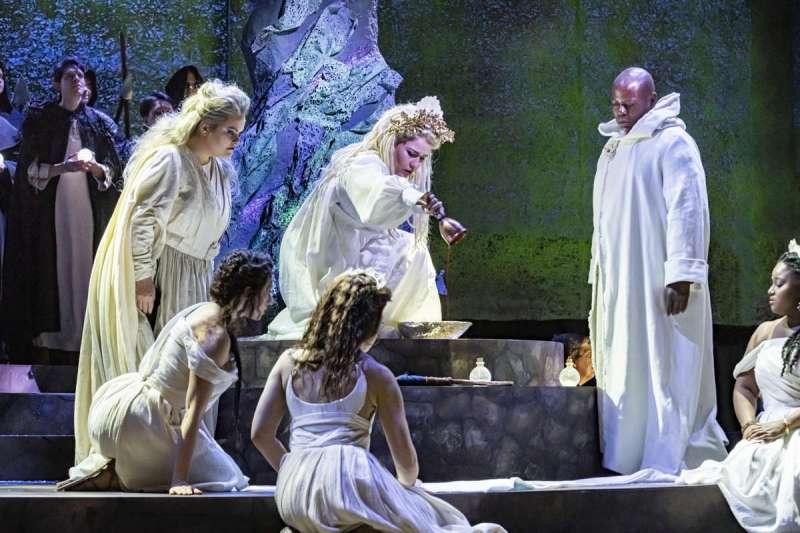 Elena Stkhina as Norma completes a ritual while, from left to right, Robyn Marie Lamp as Clotilde, Felicia Gavlines as a priestess, Sandra Piques Eddy as Adalgisa, and Alfred Walker as Oroveso look on in Boston Lyric Opera's 2020 production of Norma