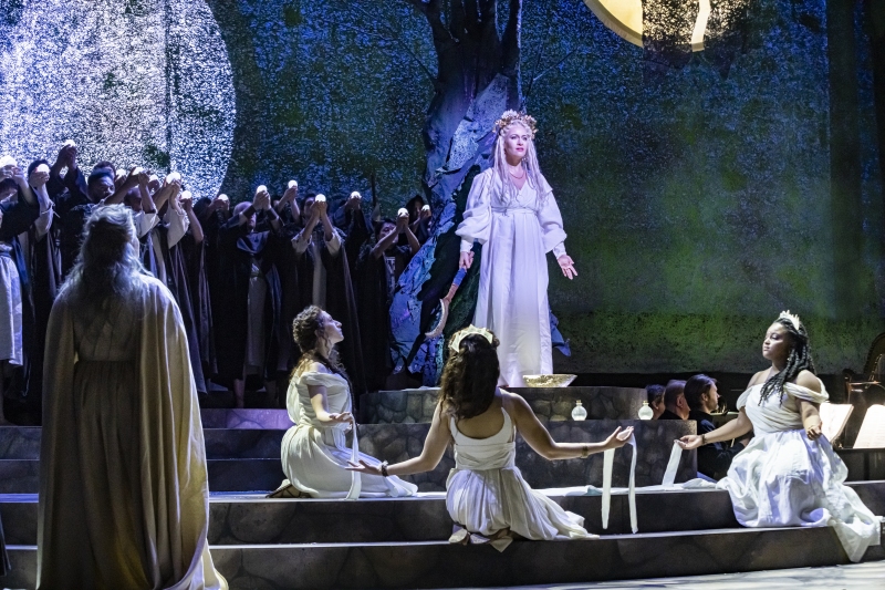 Elena Stikhina as Norma surrounded by her priestesses and other druids while performing a ritual during the Casta Diva Aria in Boston Lyric Opera's 2020 production of Norma