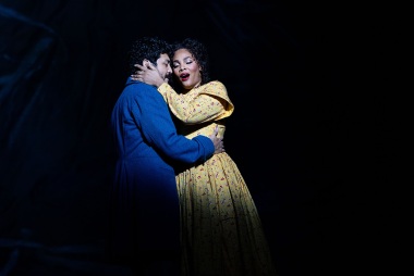 Rodolfo and Mimi share a happy moment in BLO's La boheme