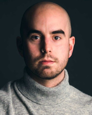 SIMON DYER, Bass, as POTTER’S ASSISTANT, BOOKSELLER, TECHNICIAN, FRENCH PRIEST, PARTY GUEST, Fellow Travelers, Boston Lyric Opera, Nov. 13-17, 2019