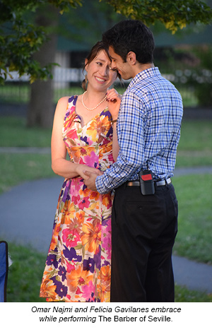 Omar Najmi and Felicia Gavilanes embrace while performing The Barber of Seville.