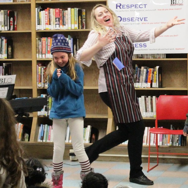 BLO Teaching Artist Lydia Jane Graeff tells an opera story at a Boston Public Library